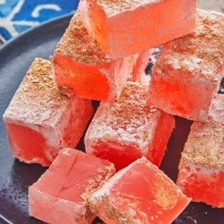 pieces of turkish delight (lokum) stacked on a small plate.