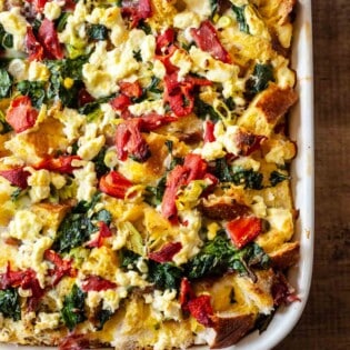 close up of cooked breakfast strata in a baking dish.