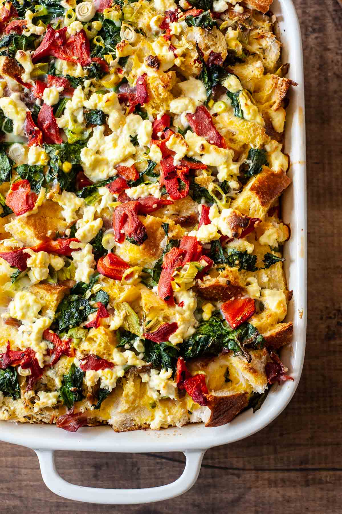 close up of cooked breakfast strata in a baking dish.