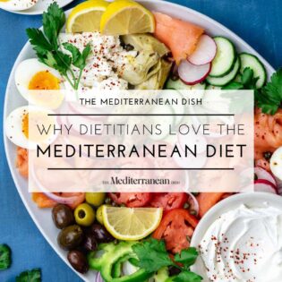 why dietitians love the mediterranean diet graphic with a a smoked salmon platter featured.