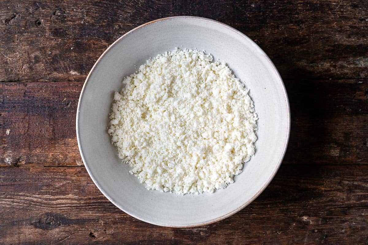 crumbled feta cheese in a bowl.