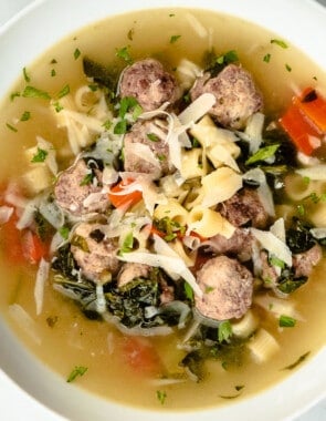 An close up over head shot of a bowl of italian wedding soup.