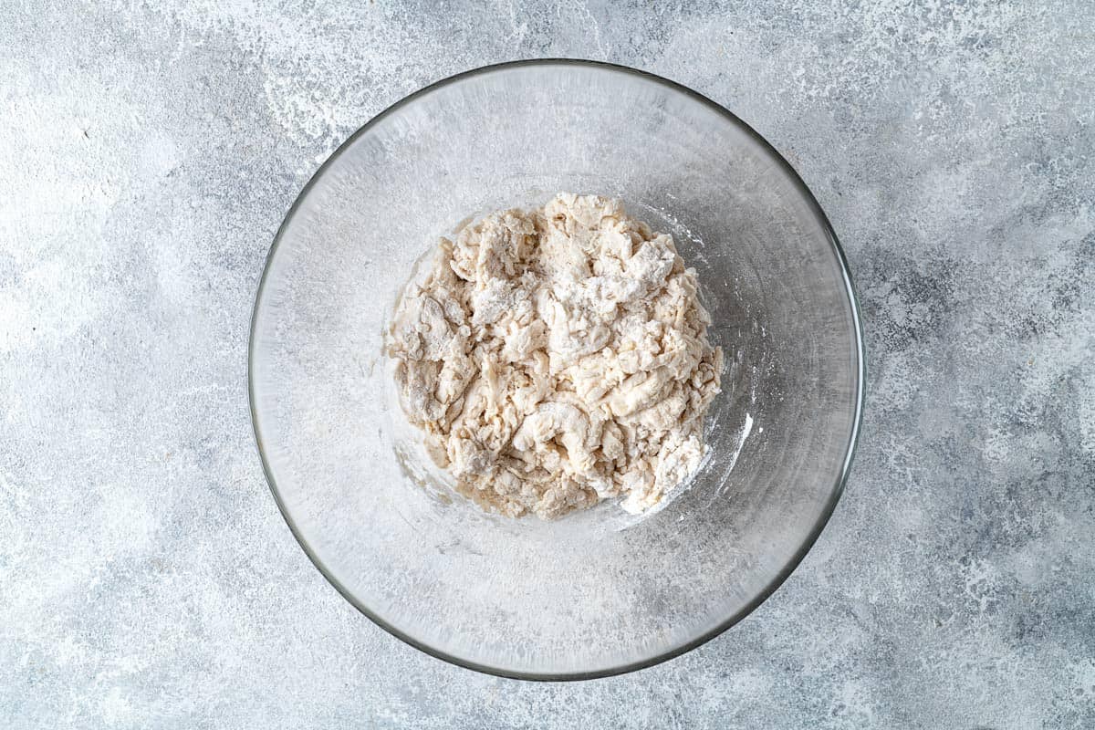 course dough formed in a bowl.