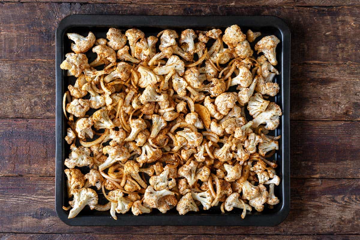 uncooked cauliflower shawarma on a sheet pan.