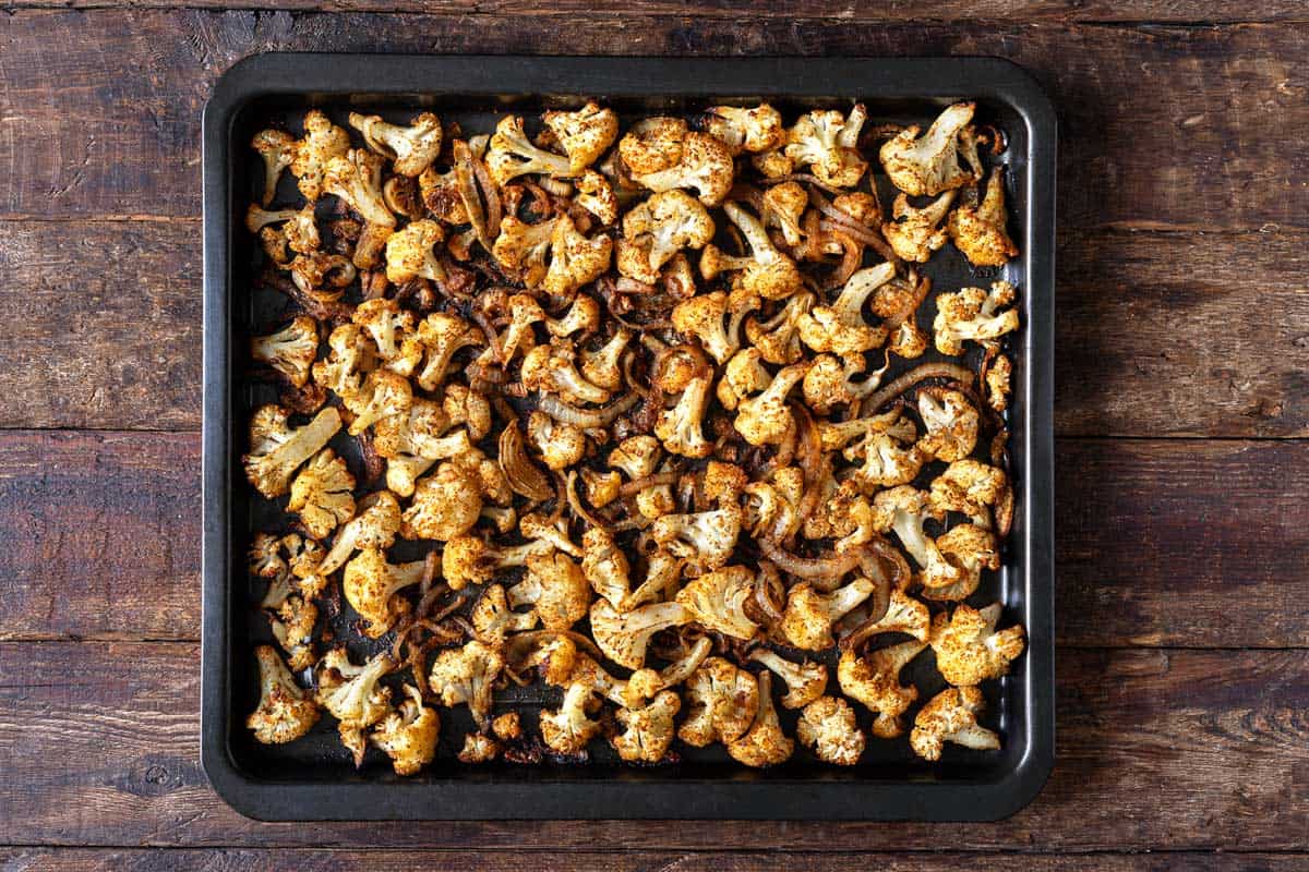 roasted cauliflower shawarma on a sheet pan.