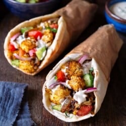 two cauliflower shawarma pitas.