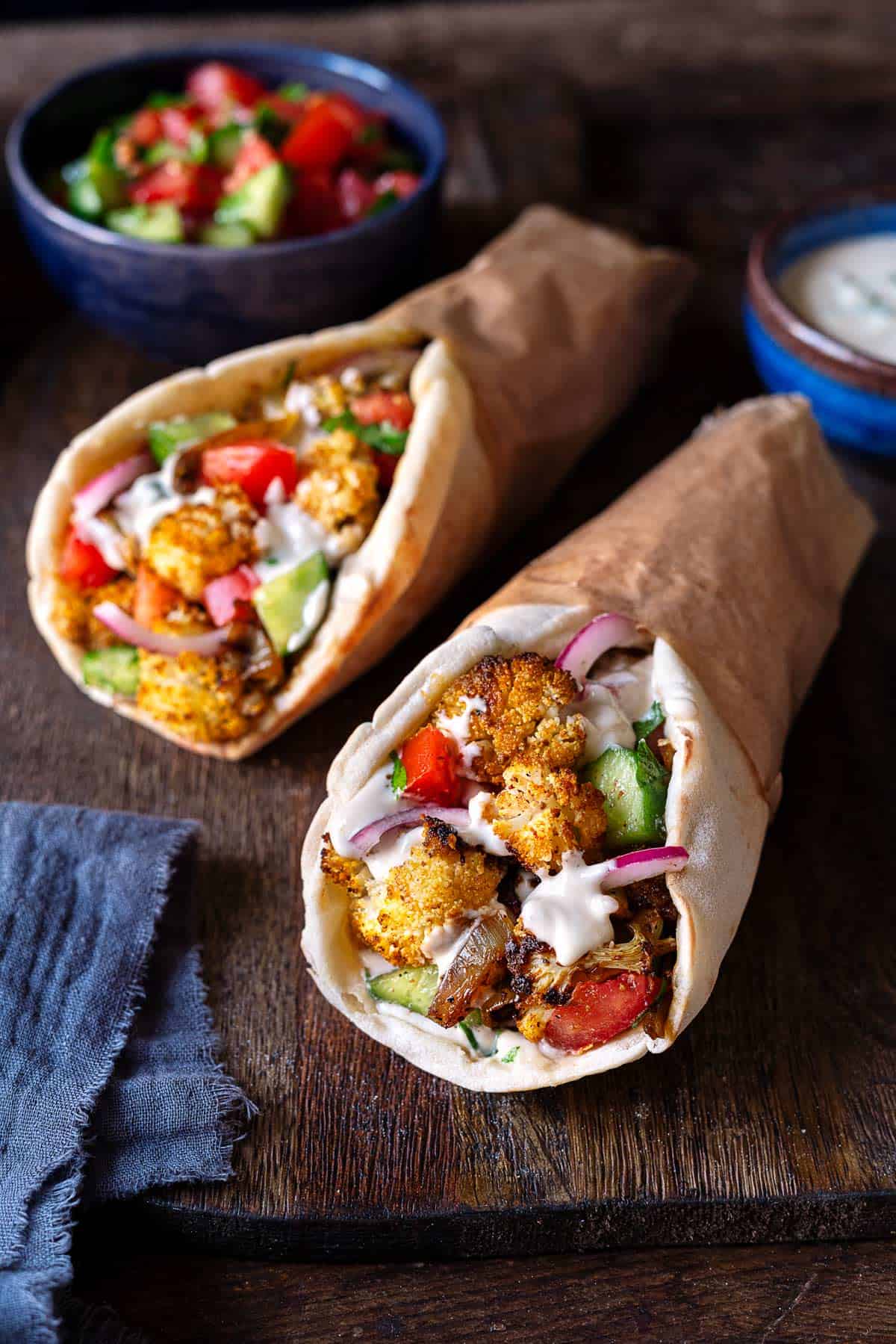 two cauliflower shawarma pitas.