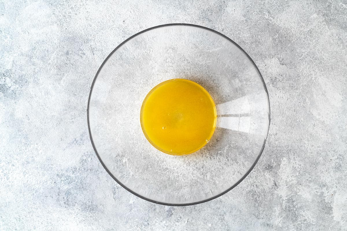 honey, lime juice and orange juice in a mixing bowl.