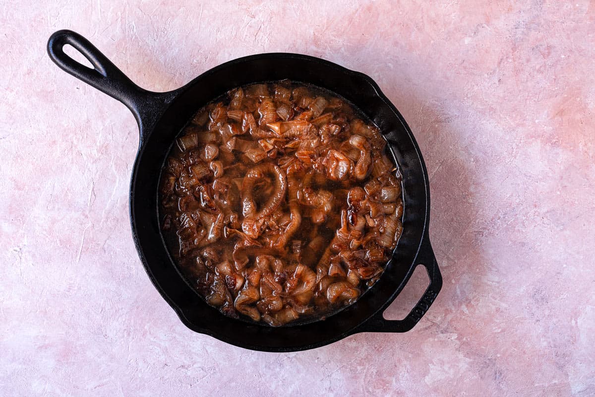 caramelized onions in a cast iron skillet.