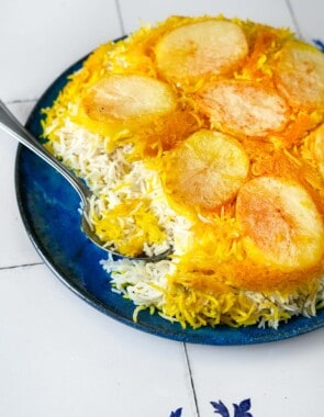 Closeup of Persian Rice with Potato Tahdig being scooped.