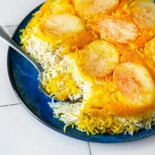 Closeup of Persian Rice with Potato Tahdig being scooped.