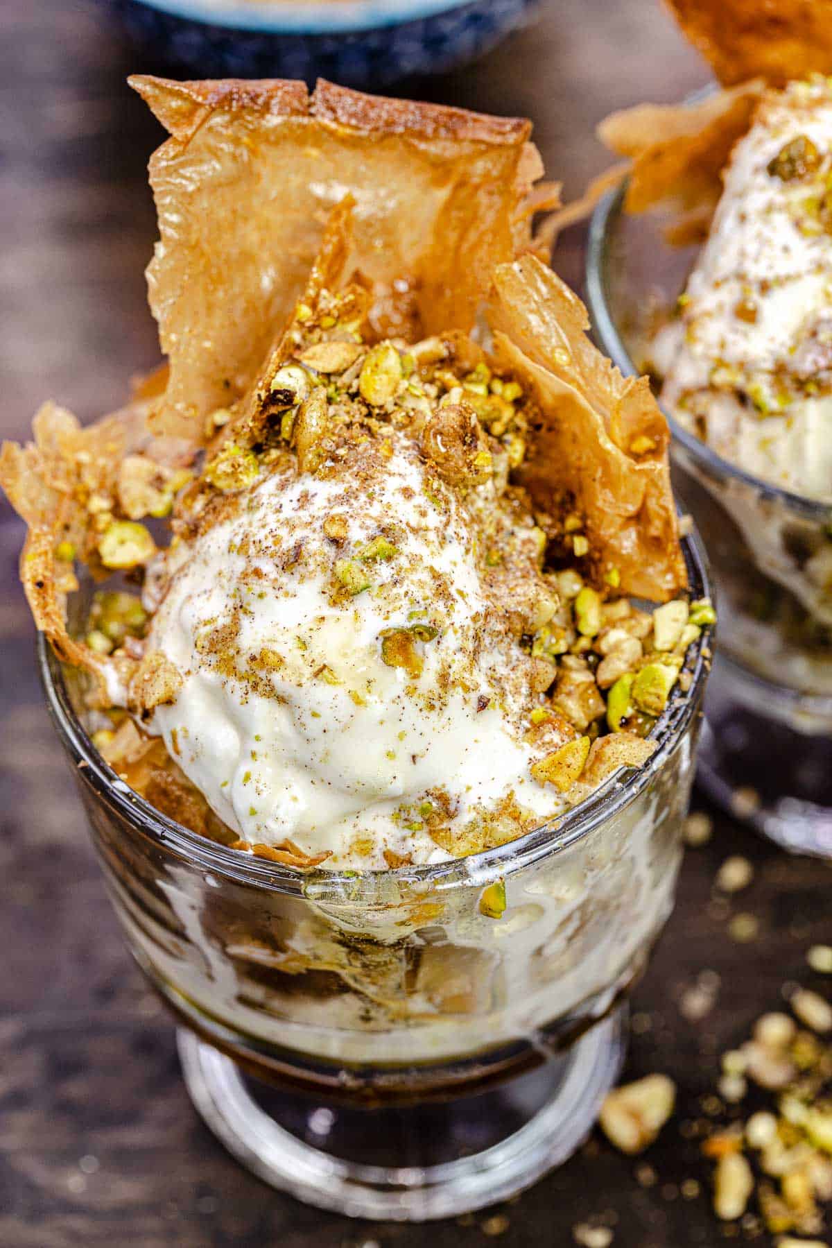 close up of a baklava ice cream sundae in a bowl.