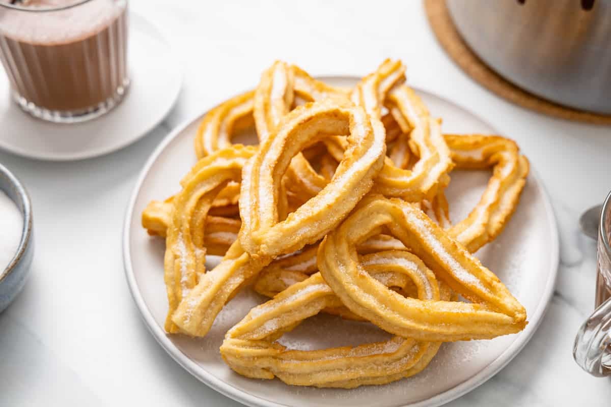 Stack of sugar-dusted Spanish-style churros.