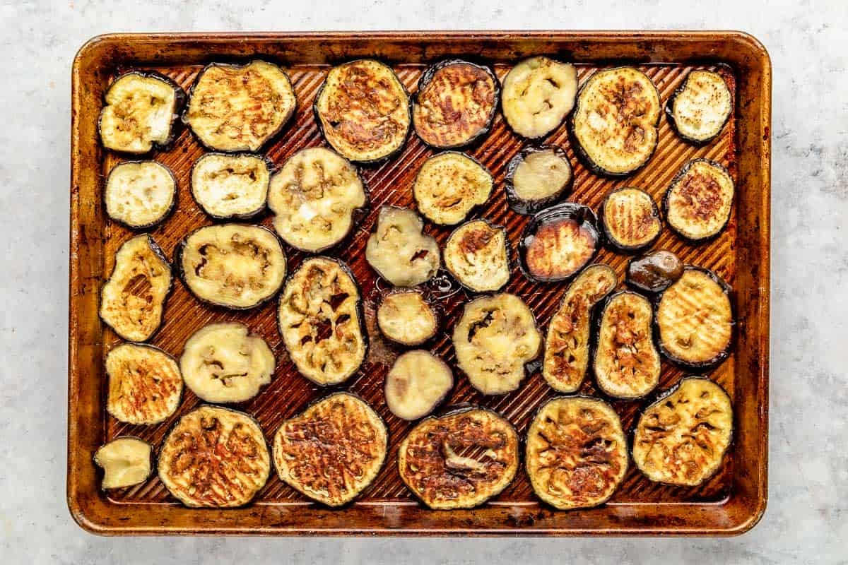 roasted eggplant slices on a baking sheet.