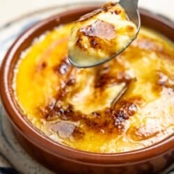 Bite of Crema Catalana with a brown caramelized crust.