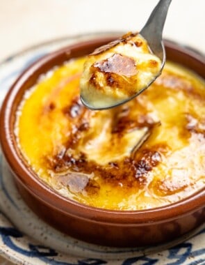 Bite of Crema Catalana with a brown caramelized crust.