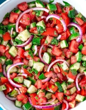 A cucumber tomato salad in a bowl.