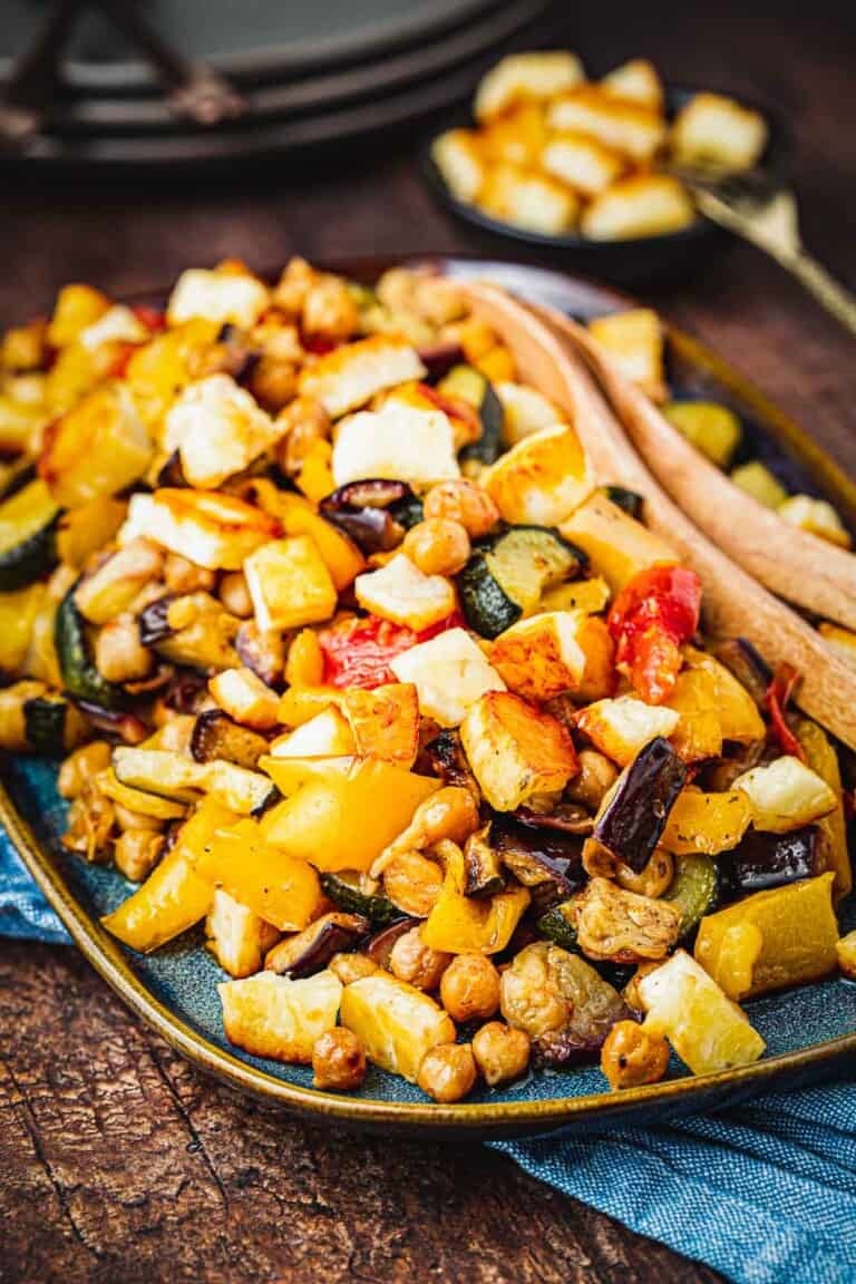Side shot of Roasted Vegetable Salad with fried Halloumi on top.