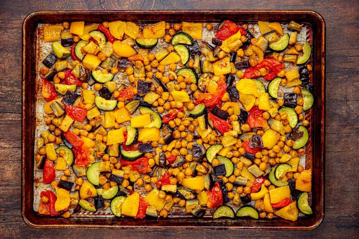 Zucchini, tomatoes, eggplant, bell peppers, and chickpeas after being roasted until golden brown.