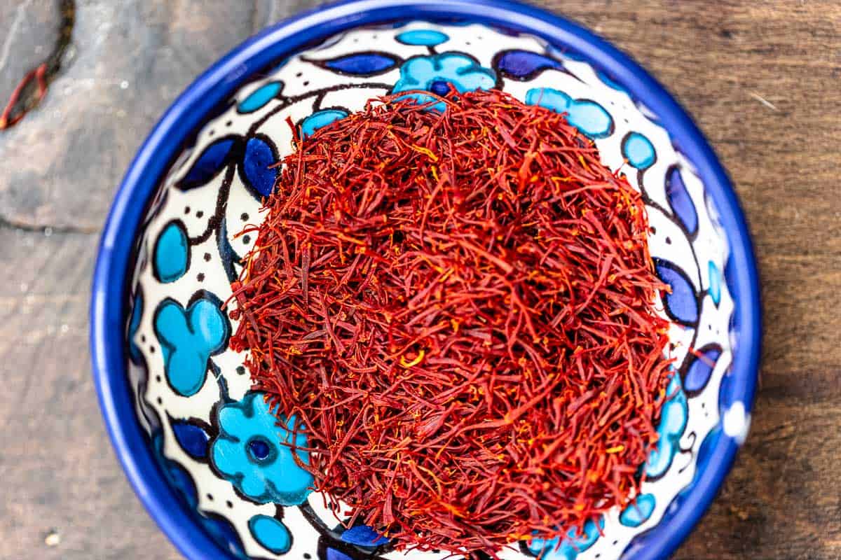 saffron threads in a blue and white bowl.