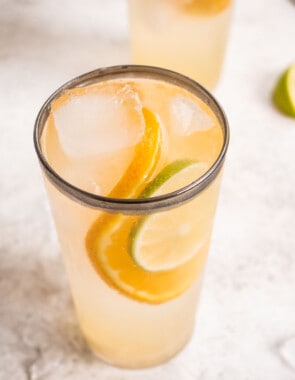 Overhead shot of the Eternal Sunshine Gin cocktail with a garnish of a lime and orange slice.