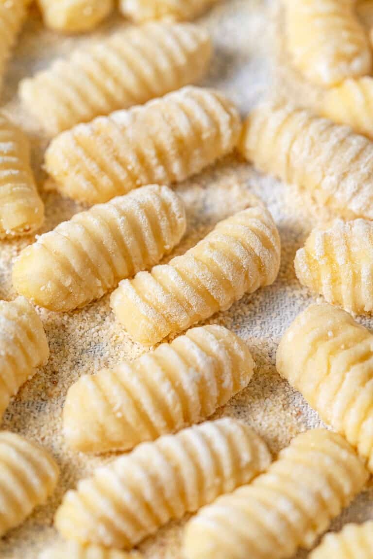 Side shot of shaped and ridged potato gnocchi.