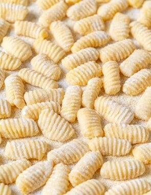 Potato gnocchi that have been dusted with semolina flour to prevent sticking.