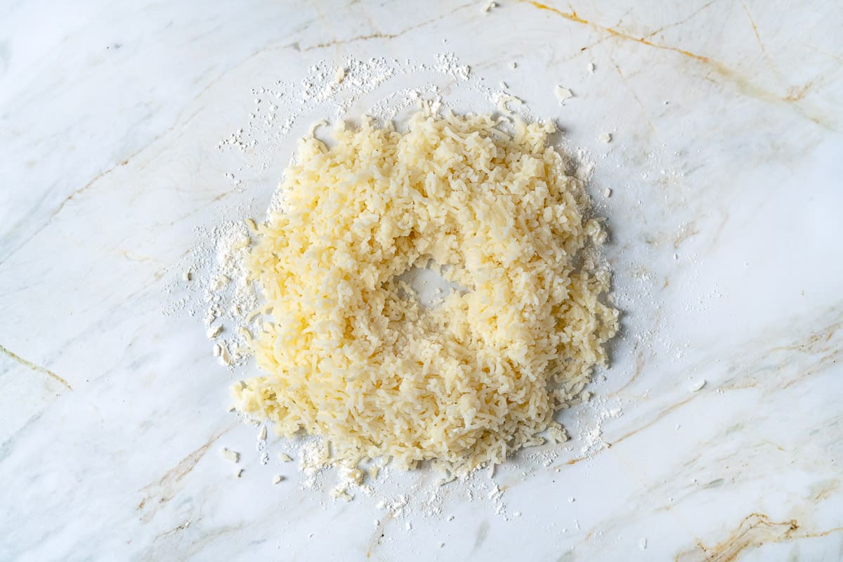 Riced potatoes formed into a mound with a cavity in the center.