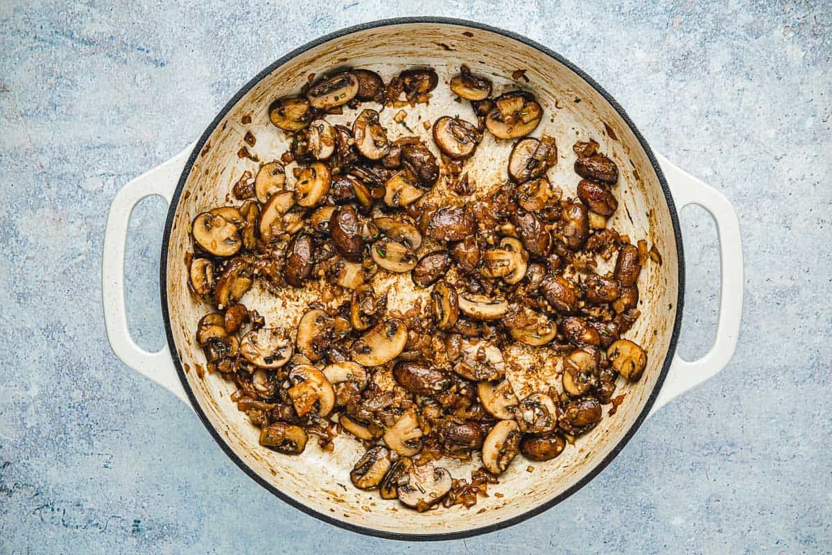 sauteed sliced mushrooms in a skillet.