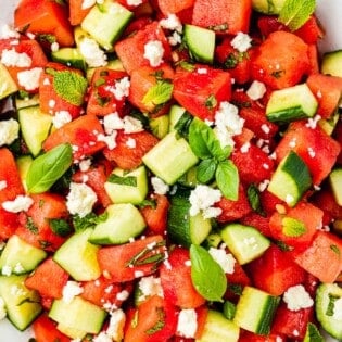 close up of watermelon salad in a bowl.