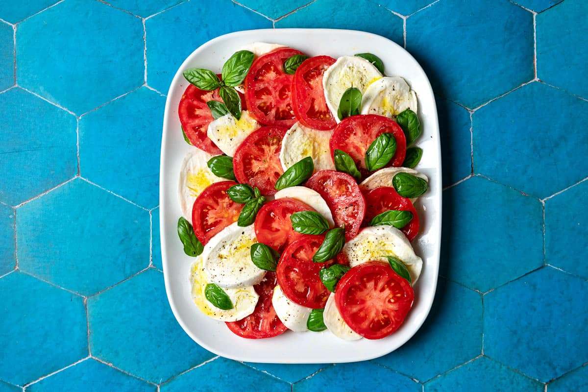 overhead photo of a caprese salad on a platter.