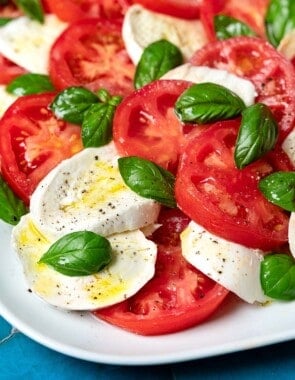 close up of a caprese salad on a platter.