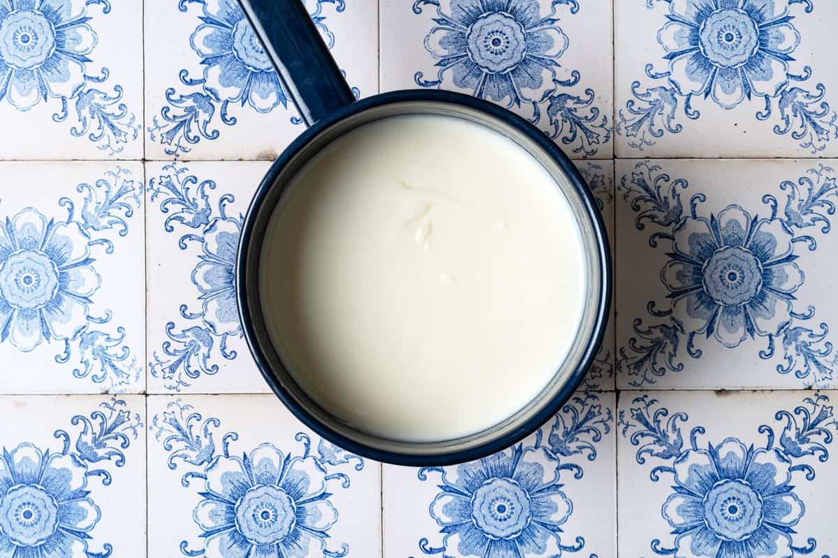 Heated milk in a saucepan.