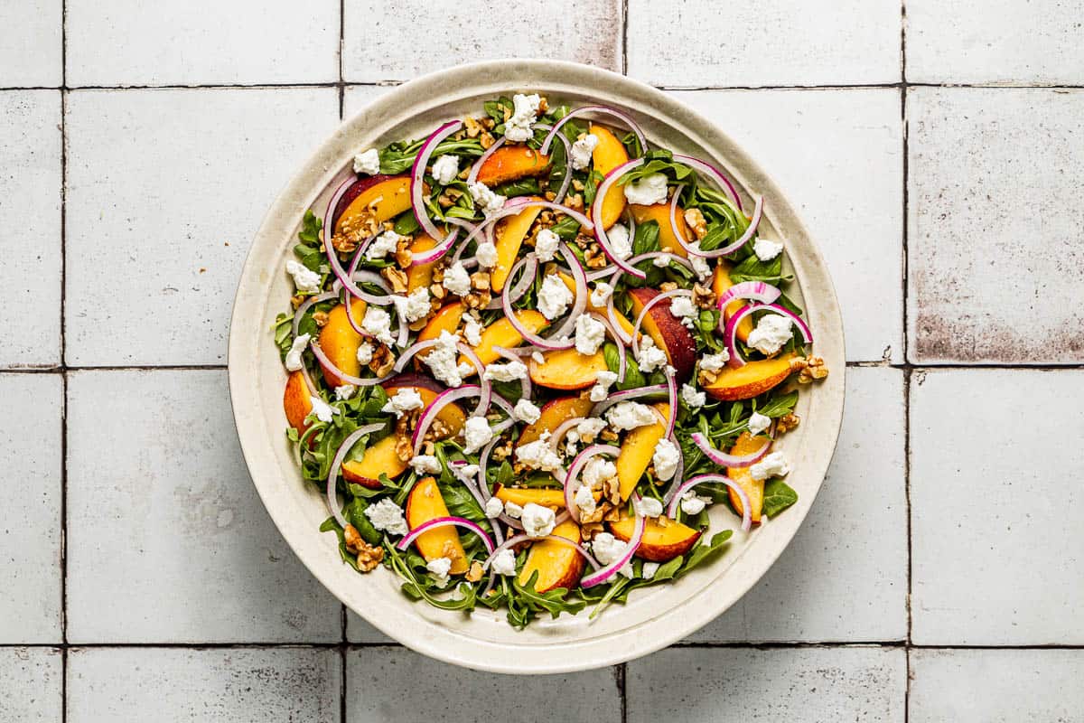 a peach salad in a serving bowl.