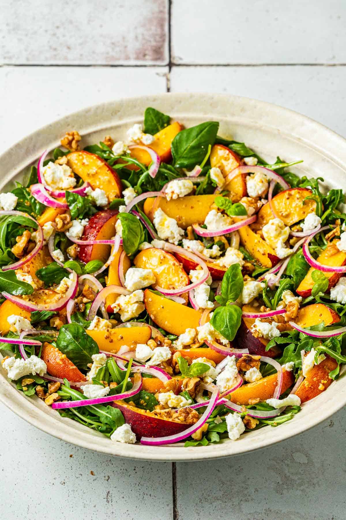 a peach salad in a serving bowl.