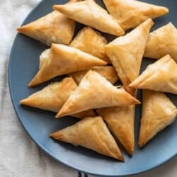 plate full of tiropitakia feta hand pies.