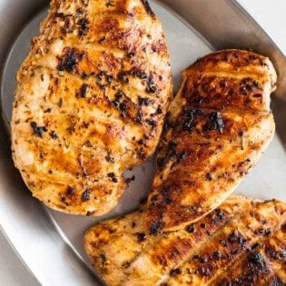 Three chicken breasts in a tray