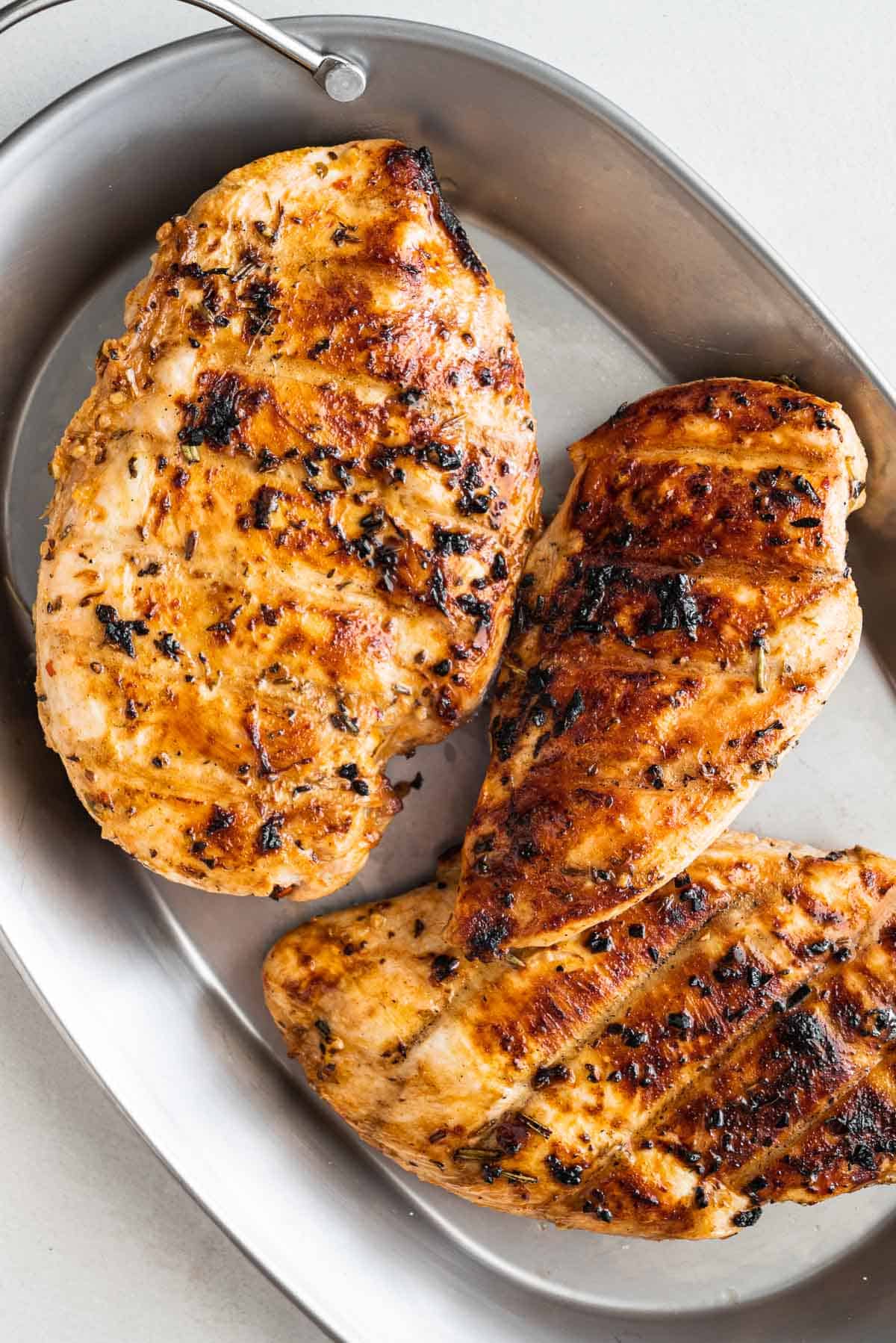 Three chicken breasts in a tray 