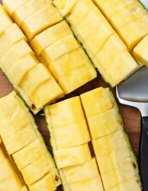 Four sliced pineapple quarters.