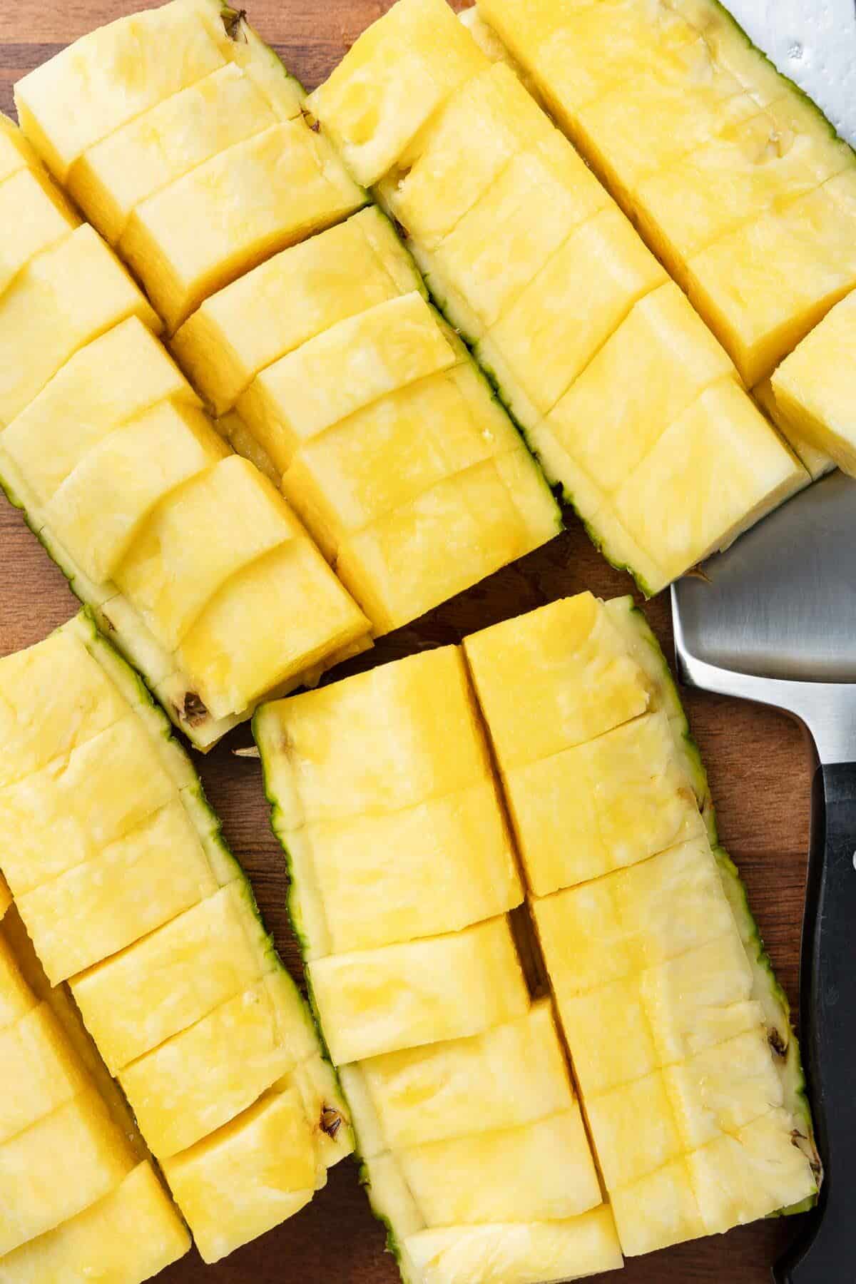 Four sliced pineapple quarters.