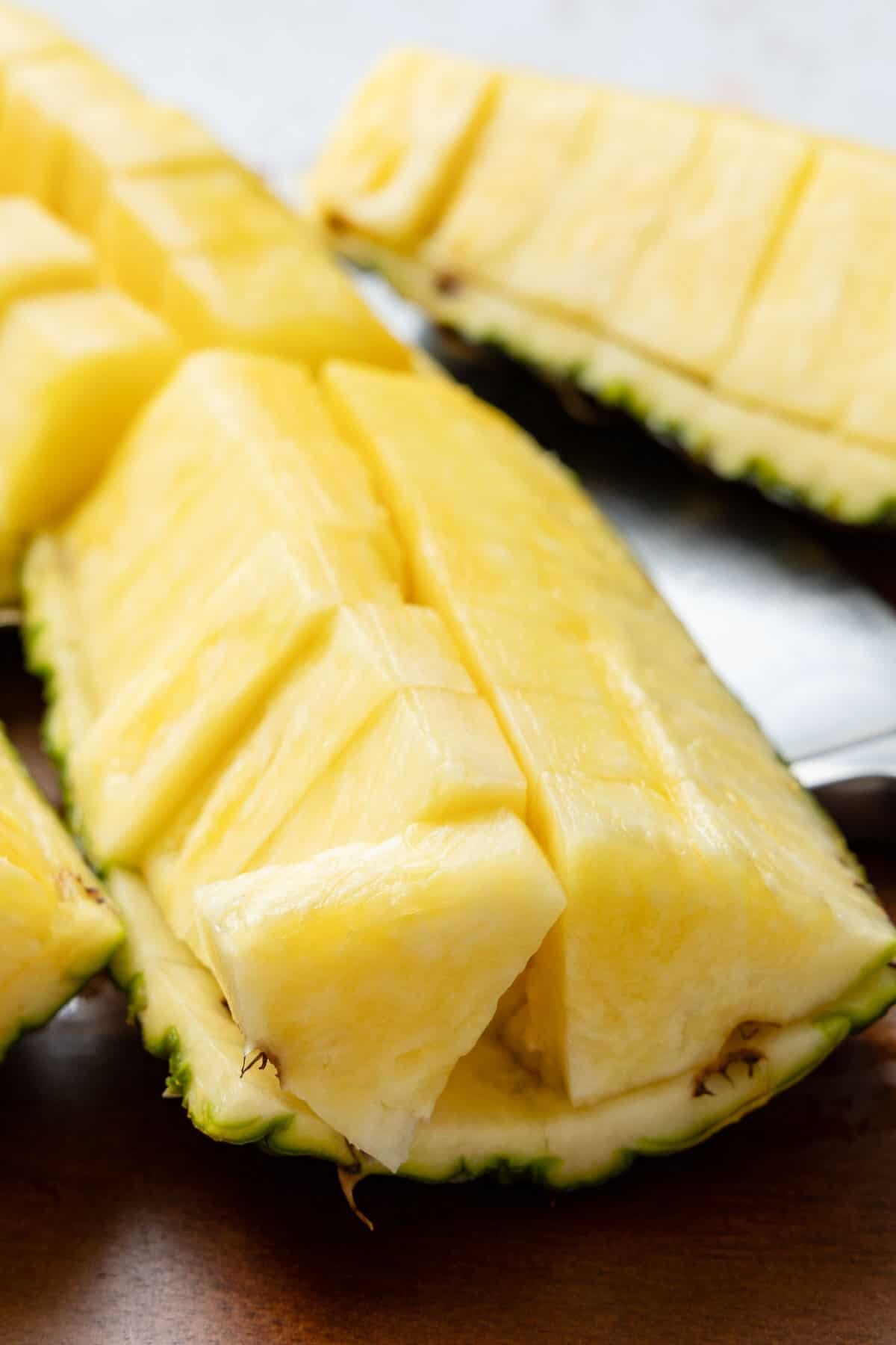 Sliced pineapple served in the skin.