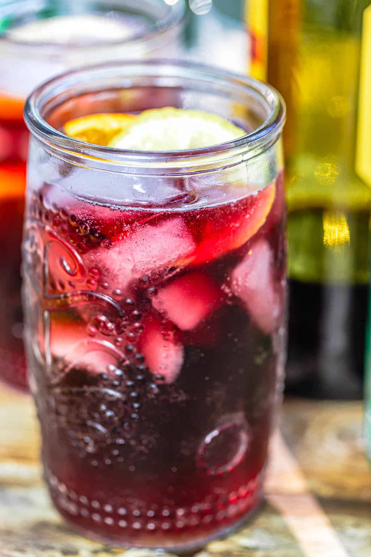 Glass of tinto de verano with a lemon and orange slice.