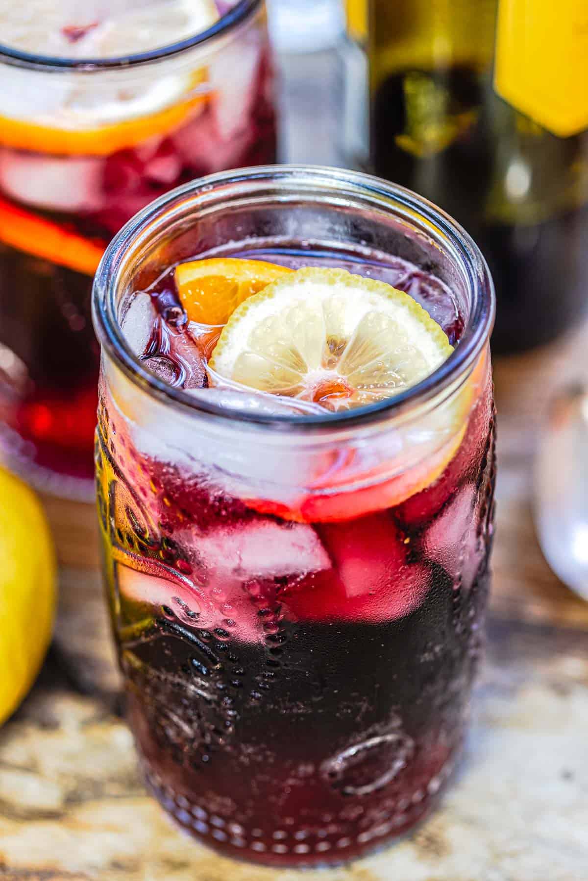 Glass of tinto de verano showing the lemon wheel garnish.