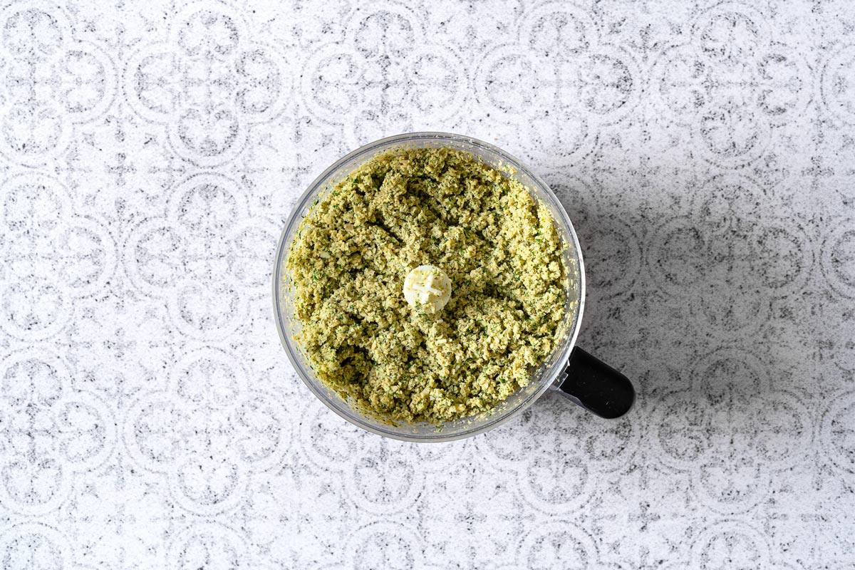 falafel mixture in a bowl of food processor.