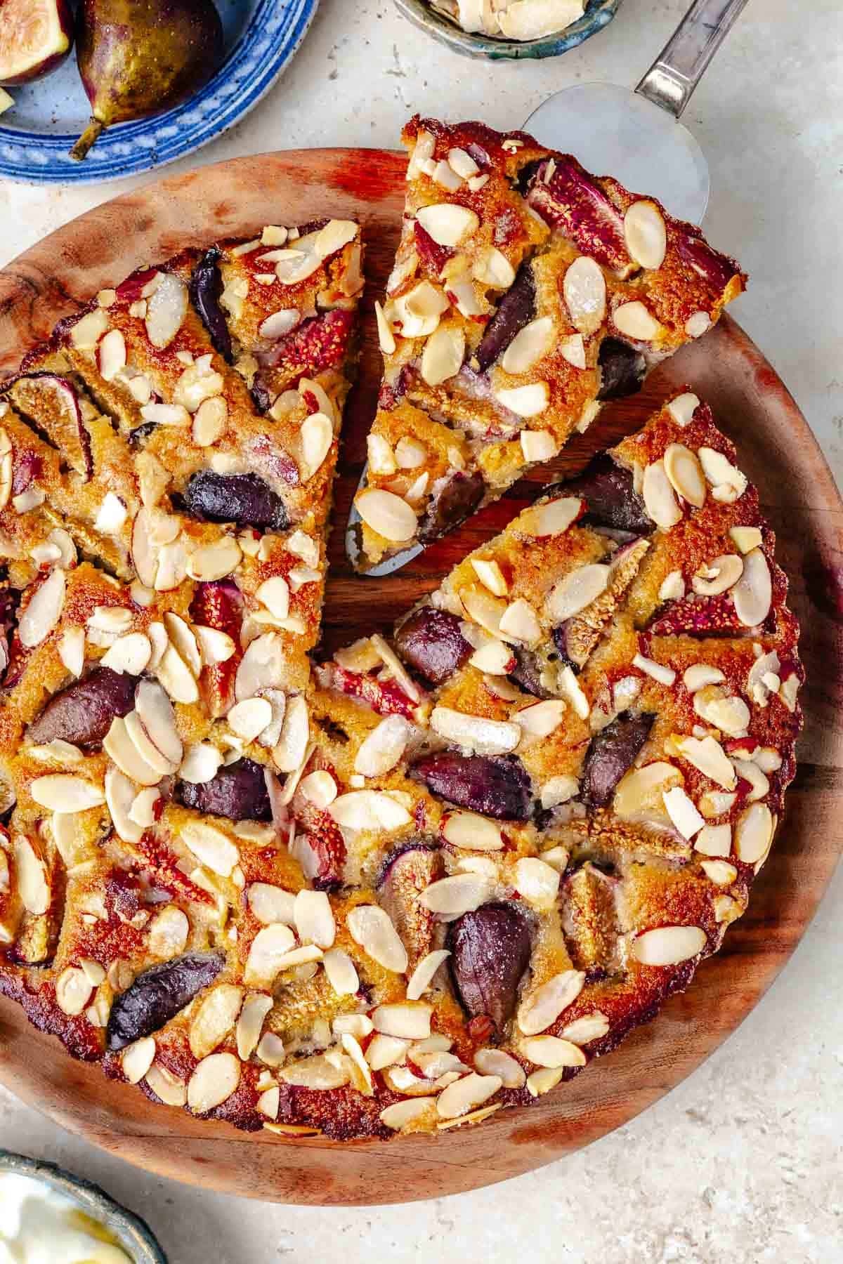 Overhead shot of fig cake with a slice taken out.