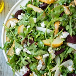 overhead photo of a serving platter of beet and goat cheese salad.