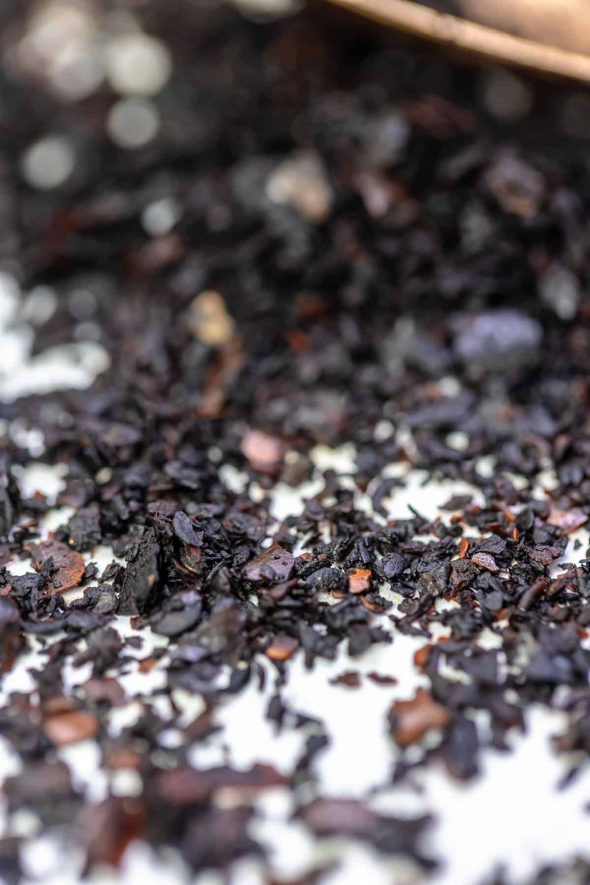 a close up of urfa biber spice sprinkled on a table.