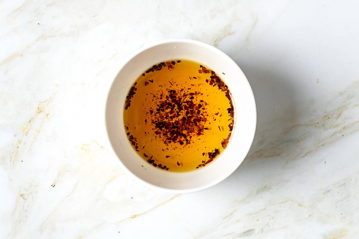 olive oil and aleppo pepper in a small white bowl.
