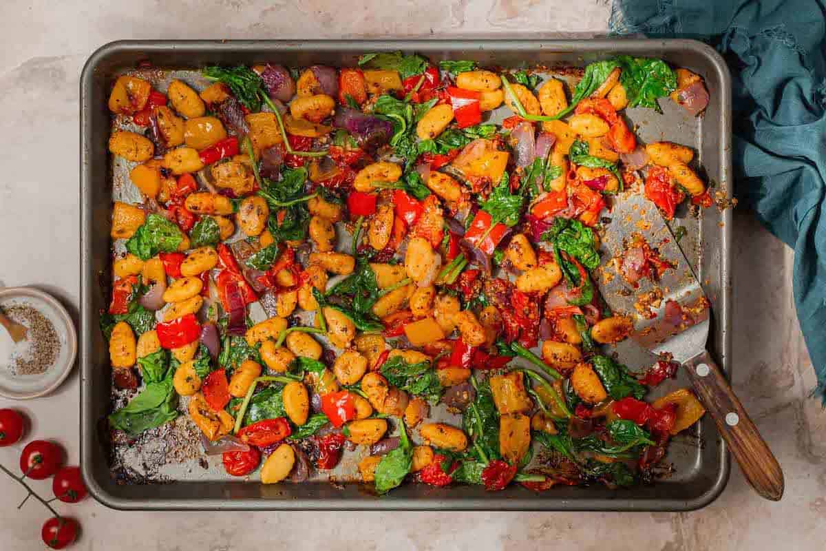 Sheet pan gnocchi that has been roasted but hasn't been finished with parmesan yet.