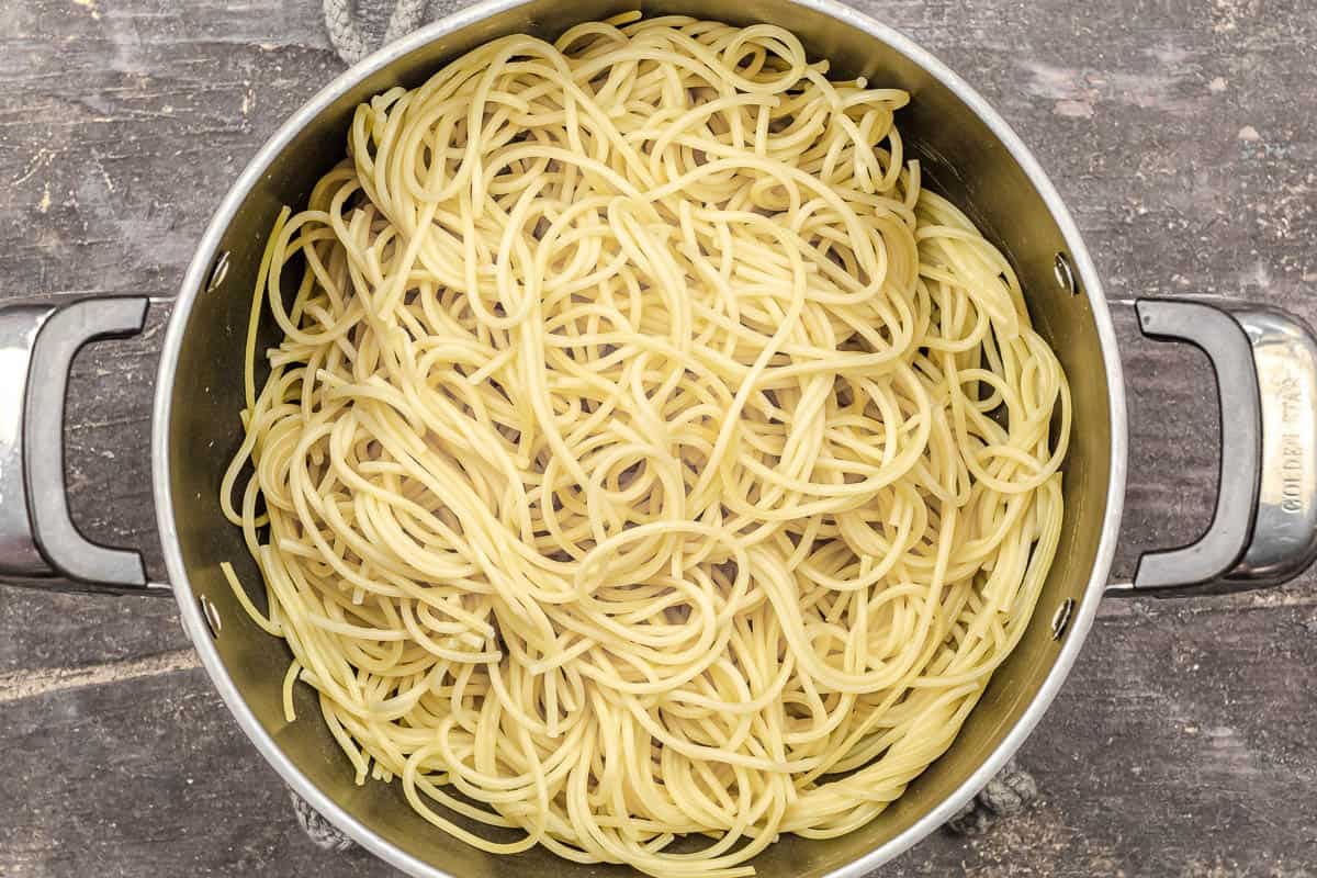 cooked and drained spaghetti in a pot.